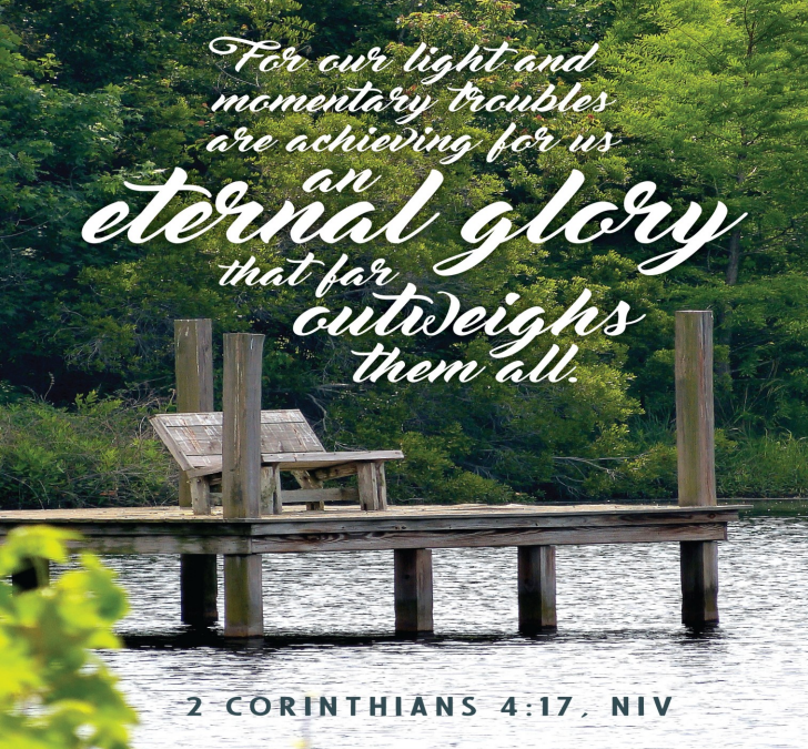 A weathered gray bench is on a pier at a beautiful lakeshore. Text is from 2 Corinthians 4:17—"For our light and momentary troubles are achieving for us an eternal glory that far outweighs them all."