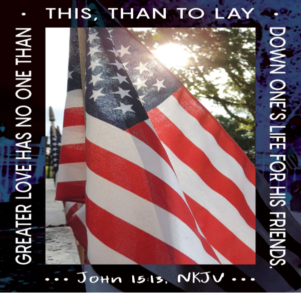 An American flag with sunlight shining through the fabric. A dark blue border surrounds the photo, and on it is the text of John 15:13— " Greater love has no one than this: to lay down one’s life for one’s friends."